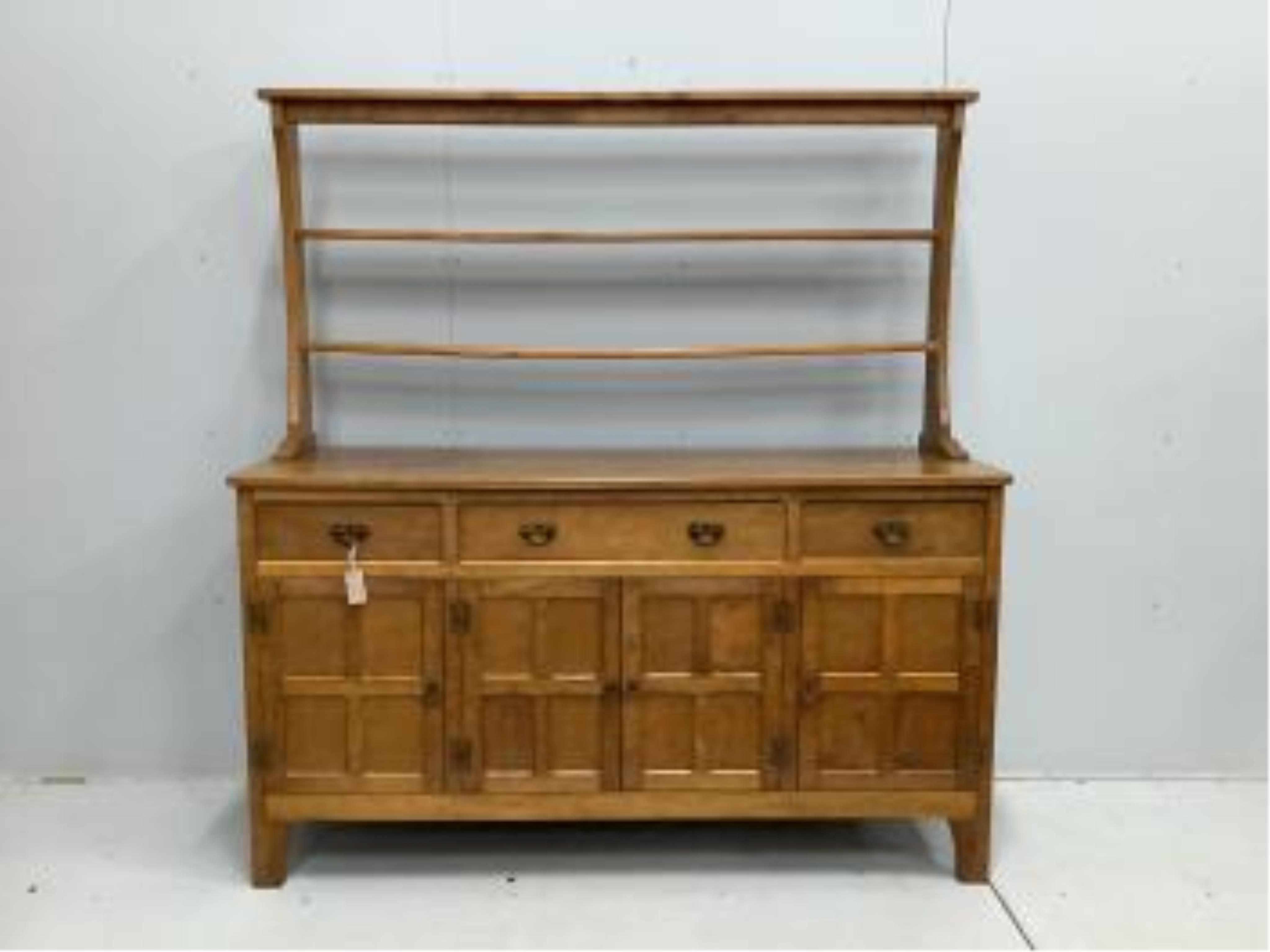 Alan Grainger 'Acorn Man', a mid century adzed oak dresser with open plate rack, width 160cm, depth 48cm, height 170cm. Condition - good